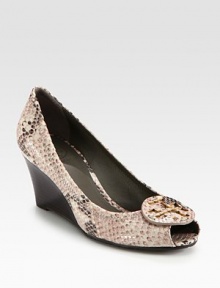 Python-print leather pump has a stacked wedge, peep toe and designer emblem. Stacked wedge, 2½ (65mm)Python-print leather upperLeather liningRubber solePadded insoleImportedOUR FIT MODEL RECOMMENDS ordering true size. Python-print leather pump has a stacked wedge, peep toe and designer emblem. Stacked wedge, 2½ (65mm)Python-print leather upperLeather liningRubber solePadded insoleImportedOUR FIT MODEL RECOMMENDS ordering true size.