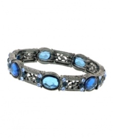 Sparkle and shine in art deco style by 2028. Etched floral filigree bracelet features faceted Austrian crystals in sapphire and Montana blue hues. Crafted in hematite-plated mixed metal. Stretches to fit wrist. Approximate diameter: 2-1/2 inches.