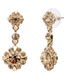 Go for the gold! Crafted in gold tone mixed metal, Monet's drop earrings dazzle with rich golden brown topaz-colored glass accents in a feminine floral pattern. Approximate drop: 1-3/8 inches. Go for the gold! Crafted in gold tone mixed metal, Monet's drop earrings dazzle with rich golden brown topaz-colored glass accents in a feminine floral pattern. Approximate drop: 1-3/8 inches.