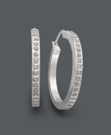 Hot hoops. Take this look to another level with hoop earrings accented by sparkling diamonds. Crafted in sterling silver. Approximate diameter: 1-1/4 inches. Hot hoops. Take this look to another level with hoop earrings accented by sparkling diamonds. Crafted in sterling silver. Approximate diameter: 1-1/4 inches.