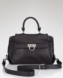 Salvatore Ferragamo's crossbody satchel in luxurious leather lends a sophisticated finish to your workday looks. Salvatore Ferragamo's crossbody satchel in luxurious leather lends a sophisticated finish to your workday looks.