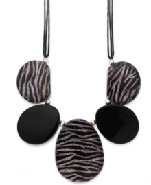 A little bit fierce, a whole lot fashionista! Style&co.'s statement-making necklace features chunky jet and zebra glitter resin beads, silver tone mixed metal beaded accents and clasp and a tripled black wax cord. Approximate length: 19-1/2 inches + 2-inch extender. Approximate drop: 3-1/2 to 4-1/2 inches.