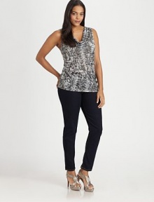 Printed to perfection, a design offering wild style and a feminine, flattering silhouette.CowlneckSleevelessAllover printPull-on styleAbout 27 from shoulder to hem65% polyester/35% viscoseDry cleanImported