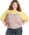 Score one of the season's hottest trends with Soprano's colorblocked plus size top, featuring sassy sleeve cutouts.