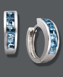 Cool off in blue hues. Baguette-cut blue topaz (2-1/2 ct. t.w.) adds chic, calming color to a traditional pair of hoops. Crafted in sterling silver. Approximate diameter: 1/2 inch. Cool off in blue hues. Baguette-cut blue topaz (2-1/2 ct. t.w.) adds chic, calming color to a traditional pair of hoops. Crafted in sterling silver. Approximate diameter: 1/2 inch.