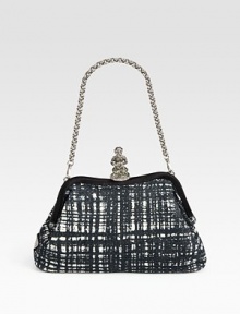 Rich tweed and satin frame-top silhouette with a monkey-clasp closure.Chain shoulder strap, 6 dropTop clasp closureOne inside zip pocketOne inside open pocketSatin lining10¾W X 6¼H X 2½DMade in Italy Rich tweed and satin frame-top silhouette with a monkey-clasp closure.Chain shoulder strap, 6 dropTop clasp closureOne inside zip pocketOne inside open pocketSatin lining10¾W X 6¼H X 2½DMade in Italy