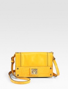 A slim leather design with crocodile embossed leather trim in a smart and sophisticated crossbody style.Shoulder strap, 21½ dropTurnlock flap closureOne inside zip pocketSatin lining8½W X 5¼H X 2½DImported A slim leather design with crocodile embossed leather trim in a smart and sophisticated crossbody style.Shoulder strap, 21½ dropTurnlock flap closureOne inside zip pocketSatin lining8½W X 5¼H X 2½DImported