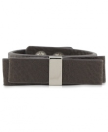 BCBGeneration makes a subtle, but bold statement with this snap bracelet. Crafted from gunmetal- and silver-tone mixed metal, the bracelet features a bow on top for a fashionable touch. Approximate length: 8 inches. BCBGeneration makes a subtle, but bold statement with this snap bracelet. Crafted from gunmetal- and silver-tone mixed metal, the bracelet features a bow on top for a fashionable touch. Approximate length: 8 inches.
