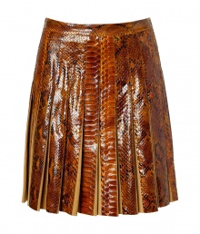 The ultimate showstopper! This ultra-luxe python and suede pleated skirt from Salvatore Ferragamo begs to be shown off in style - Fitted waist, allover pleating, concealed side zip closure, made with supple suede and glossy python - Flared silhouette - Wear with a cashmere turtleneck, a neutral-hued cape, and classic pumps The ultimate showstopper! This ultra-luxe python and suede pleated skirt from Salvatore Ferragamo begs to be shown off in style - Fitted waist, allover pleating, concealed side zip closure, made with supple suede and glossy python - Flared silhouette - Wear with a cashmere turtleneck, a neutral-hued cape, and classic pumps