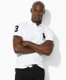 Designed with a relaxed cut through the body and a longer hem, an iconic polo shirt is rendered in breathable cotton mesh with athletic details for sporty style.