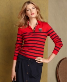 Tommy Hilfiger's polo top channels heritage chic with an embroidered logo patch and bold, bright stripes.