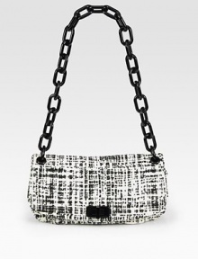 Rich tweed design with a turnlock flap closure and chain strap.Plexiglas® shoulder strap, 13 dropFlap with turnlock closureOne back open pocketOne inside zip pocketTwo inside open pocketsLeather lining11¾W X 6¼H X 1DMade in Italy Rich tweed design with a turnlock flap closure and chain strap.Plexiglas® shoulder strap, 13 dropFlap with turnlock closureOne back open pocketOne inside zip pocketTwo inside open pocketsLeather lining11¾W X 6¼H X 1DMade in Italy