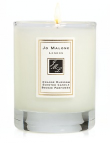 Add the finishing touch to your home by decorating interiors with the refreshingly delicious scent of Orange Blossom. This 2.1 oz. scented travel candle will help create the perfect ambience in any room. Burn time approx. 15 hrs. Add the finishing touch to your home by decorating interiors with the refreshingly delicious scent of Orange Blossom. This 2.1 oz. scented travel candle will help create the perfect ambience in any room. Burn time approx. 15 hrs.