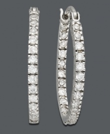 Make your outfit pop with a touch of sparkle. Crafted in sterling silver, oval-shaped hoops by B. Brilliant feature round-cut cubic zirconias (1/2 ct. t.w.). Approximate diameter: 7/8 inch. Make your outfit pop with a touch of sparkle. Crafted in sterling silver, oval-shaped hoops by B. Brilliant feature round-cut cubic zirconias (1/2 ct. t.w.). Approximate diameter: 7/8 inch.