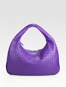 This woven leather design is accented with a plaited leather trim.Top handle, 5 dropTop zip closureOne inside zip pocketSuede lining16½W X 10½H X 2½DMade in Italy This woven leather design is accented with a plaited leather trim.Top handle, 5 dropTop zip closureOne inside zip pocketSuede lining16½W X 10½H X 2½DMade in Italy
