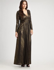 Shimmering, floor-length v-neck with a ruched silhouette and flattering empire waist. Gathered v-neckRuched empire waistLong sleevesInvisible back zipperAbout 65 from shoulder to hemFully lined92% polyester/8% spandexDry cleanMade in USA of imported fabric