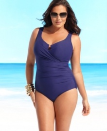 A simply chic plus size swimsuit from Miraclesuit with gentle ruching at the waist for added flatter power. A simply chic plus size swimsuit from Miraclesuit with gentle ruching at the waist for added flatter power.