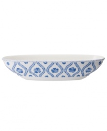Vintage charm meets modern durability in the Farmhouse Touch oval bowl, featuring cornflower-blue laurels and blooms in premium porcelain from Villeroy & Boch. Vintage charm meets modern durability in the Farmhouse Touch oval bowl, featuring cornflower-blue laurels and blooms in premium porcelain from Villeroy & Boch.