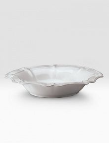 A beautiful stoneware bowl is handcrafted with elegant curves to bring rustic detail and irresistibly romantic European charm to a dinner or party. 80-ounce capacity 5H X 15½ diam. Dishwasher and oven safe Imported A beautiful stoneware bowl is handcrafted with elegant curves to bring rustic detail and irresistibly romantic European charm to a dinner or party. 80-ounce capacity 5H X 15½ diam. Dishwasher and oven safe Imported