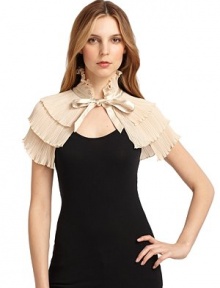 THE LOOKTiered accordion pleatingSatin ribbon tie closureGently ruffledTHE FITAbout 11 from shoulder to hemTHE MATERIALPolyesterCARE & ORIGINDry cleanImported