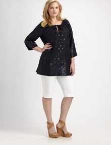 An enticing tunic with spectacular beading, a flattering fit and convenient slash pockets. Round neckSelf-tieThree-quarter sleevesSlash pocketsPull-on styleAbout 32 from shoulder to hemLinenDry cleanImported