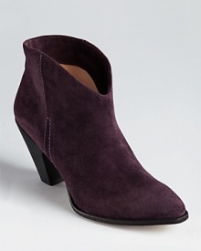 A western-inspired bootie silhouette from Belle by Sigerson Morrison slips on with a flowing skirt for bohemian chic.