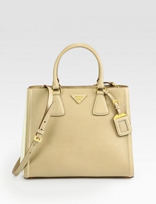 A two-tone style in luxurious saffiano leather.Double top handles, 5½ dropDetachable adjustable shoulder strap, 17-19 dropSnap button closureProtective metal feetTwo inside zip pocketsThree inside open pocketsLogo lining13W X 11H X 6¼DMade in Italy A two-tone style in luxurious saffiano leather.Double top handles, 5½ dropDetachable adjustable shoulder strap, 17-19 dropSnap button closureProtective metal feetTwo inside zip pocketsThree inside open pocketsLogo lining13W X 11H X 6¼DMade in Italy