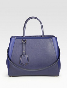 A roomy style in luxurious leather and matching coated twill with signature hardware.Double coated twill top handles, 5½ dropDetachable leather shoulder strap, 13¼ dropSnap strap closureProtective metal feetThree inner compartmentsTwo inside open pocketsFully lined14W X 10¾H X 6DMade in Italy A roomy style in luxurious leather and matching coated twill with signature hardware.Double coated twill top handles, 5½ dropDetachable leather shoulder strap, 13¼ dropSnap strap closureProtective metal feetThree inner compartmentsTwo inside open pocketsFully lined14W X 10¾H X 6DMade in Italy