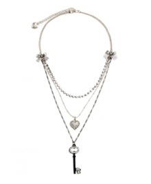 Sweet layers of femininity for the blossoming fashionista. Another innovative design by Betsey Johnson - necklace features ribbon accents with a sparkling strand of crystal, a crystal coated heart charm, and a black-plated crystal key. Necklace crafted in antique silver tone mixed metal. Approximate length: 16 inches + 3-inch extender. Approximate drop: 1-3 inches.