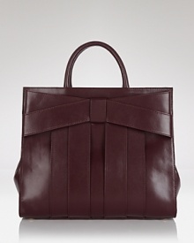 Shapely and spacious. This bow-bedecked satchel from Z Spoke Zac Posen encapsulates the ladylike look in luxurious fashion.