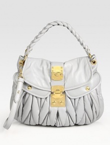 Ruched lambskin finished with a braided top handle and polished goldtone hardware.Top handle, 3¼ dropDetachable shoulder strap, 20 dropFlap-and-clasp coffer closureMetal letter logo detailTwo outside open pocketsOne inside zip pocketOne inside open pocketCotton/satin lining15W X 11¾H X 2¼DMade in Italy Ruched lambskin finished with a braided top handle and polished goldtone hardware.Top handle, 3¼ dropDetachable shoulder strap, 20 dropFlap-and-clasp coffer closureMetal letter logo detailTwo outside open pocketsOne inside zip pocketOne inside open pocketCotton/satin lining15W X 11¾H X 2¼DMade in Italy