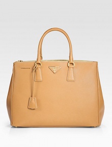 Rich calfskin leather finished with signature etching, all in a structured tote silhouette.Double top handles, 5 drop Zip and snap closure Protective metal feet One center zip compartment Two inside zip pockets Three inside open pockets Signature jacquard lining 14W X 10½H X 6D Made in Italy Rich calfskin leather finished with signature etching, all in a structured tote silhouette.Double top handles, 5 drop Zip and snap closure Protective metal feet One center zip compartment Two inside zip pockets Three inside open pockets Signature jacquard lining 14W X 10½H X 6D Made in Italy