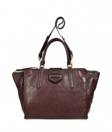 Rich, dark brown bag in soft cow and lamb leather - Designed in a trendy and functional shopper shape - Features short handle and a long, adjustable strap option - Gold-colored hardware - Top zipper closure - Beautiful, high-quality design upgrades business and leisure looks Rich, dark brown bag in soft cow and lamb leather - Designed in a trendy and functional shopper shape - Features short handle and a long, adjustable strap option - Gold-colored hardware - Top zipper closure - Beautiful, high-quality design upgrades business and leisure looks