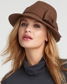 A large pinked edge bow gives this masculine trilby style hat just the right amount of ladylike appeal.