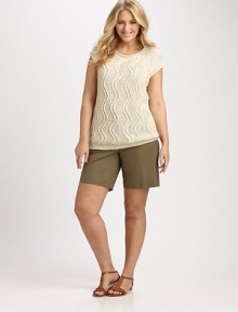 Cable-knit chic, slip into this stretch cotton top, which features a wavy pattern for an unforgettable look.V-necklineCap sleevesRibbed trimPull-on styleAbout 28 from shoulder to hem66% cotton/34% polyamideHand washImported of Italian fabric