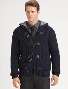 A cozy, wool knit with a nautical-inspired toggle closure for relaxed, yet rustic look.Two-way zip frontToggle button-frontAttached hoodSide slash pocketsRibbed knit cuffs and hemWoolDry cleanImported