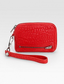Rich and supple pebbled lambskin leather in a portable size.Detachable wrist strap, 6½ dropTop zip closureTwo outside zip pocketsFour credit card slotsTwo inside open pocketsFully lined5¾W X 4½H X 1DImported Rich and supple pebbled lambskin leather in a portable size.Detachable wrist strap, 6½ dropTop zip closureTwo outside zip pocketsFour credit card slotsTwo inside open pocketsFully lined5¾W X 4½H X 1DImported