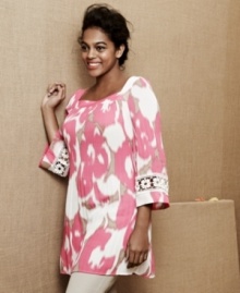 Take your casual look to a whole new level of chic with Alfani's three-quarter sleeve plus size tunic top, accented by crochet insets. Take your casual look to a whole new level of chic with Alfani's three-quarter sleeve plus size tunic top, accented by crochet insets.