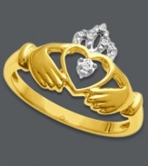 Cherish your Irish heritage. This symbolic ring features a cut-out Claddagh design with sparkling diamond accents at the crown and heart. Crafted in 14k gold.