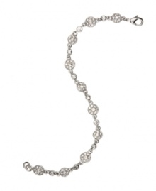 A fresh find to add shine to your wardrobe. Monet's bracelet features medallion-shaped links set with stunning clear crystal. Crafted in silvertone mixed metal. Approximate length: 7 inches.