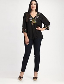 Floral embroidery offers charming pops of color on this tunic. You will love its relaxed fit and flattering silhouette.V-necklineThree-quarter sleevesEmbroidered detailsAsymmetrical hemAbout 30 from shoulder to hemRayonMachine washImported