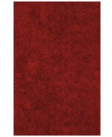 Add a pop of rich, shimmering red to any modern room with the Metallic area rug from Dalyn. Hand-tufted of soft polyester, this high-luster shag area rug puts comfort and fun back in floor decor.