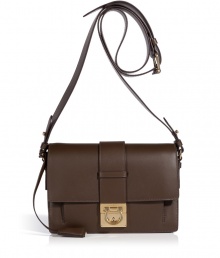 Invest in classic sophisticated style with Salvatore Ferragamos luxurious dark brown leather crossbody bag - Boxy shape, front flap with gold-tone Gancini logo lock closure, buckled crossbody strap, inside front sectional pocket, zippered back wall pocket, leather lining - Perfect for off-duty chic or elegant workweek style Invest in classic sophisticated style with Salvatore Ferragamos luxurious dark brown leather crossbody bag - Boxy shape, front flap with gold-tone Gancini logo lock closure, buckled crossbody strap, inside front sectional pocket, zippered back wall pocket, leather lining - Perfect for off-duty chic or elegant workweek style
