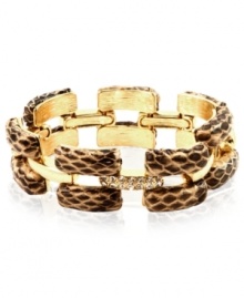 Sink your teeth into this chic bracelet from Ann Klein. The slip-on design features rectangular links covered in snake skin leather. Crafted in gold tone mixed metal. Approximate length: 8 inches.