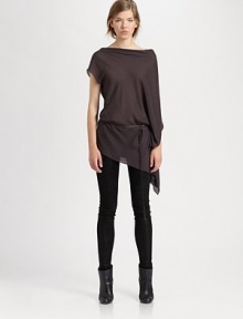 Finished with a detachable leather belt, this semi-sheer boatneck has a single cape sleeve, single short sleeve and an asymmetrical hem. BoatneckSingle short sleeveSingle cape sleeveDetachable leather beltAsymmetrical hemViscoseDry cleanImported of Italian fabricModel shown is 5'10 (177cm) wearing US size Small.OUR FIT MODEL RECOMMENDS ordering true size. 