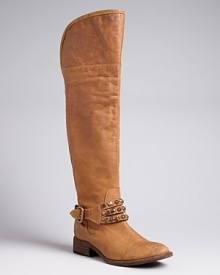 Smokin' hot: These STEVEN BY STEVE MADDEN tall, suede boots are set off to perfection with brilliantly studded ankle harnesses. They're moto-meets-Western and ready to ride.