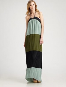 The dynamic trend of the season, colorblocking, seamlessly combines with a timeless, pleated maxi silhouette for a flawless finish.Halter ties at neckAllover pleatsSide zipperAbout 40 from natural waistPolyesterDry cleanImported Model shown is 5'10½ (179cm) wearing US size 4. 