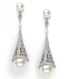 Do elaborate. Add elegance and excellence in Eliot Danori's exquisite cone-shaped crystal-accented drop earrings. Crafted in rhodium-plated mixed metal with simulated pearl drops and simulated pearl accents (4, 8, and 12 mm). Approximate drop: 2-1/4 inches. Do elaborate. Add elegance and excellence in Eliot Danori's exquisite cone-shaped crystal-accented drop earrings. Crafted in rhodium-plated mixed metal with simulated pearl drops and simulated pearl accents (4, 8, and 12 mm). Approximate drop: 2-1/4 inches.