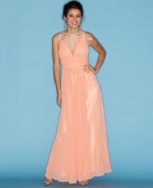 Studded cutouts create dazzling, webbed back work on this chiffon gown from B Darlin! Accessorize it with chandelier earrings for style that's fashion magic. Studded cutouts create dazzling, webbed back work on this chiffon gown from B Darlin! Accessorize it with chandelier earrings for style that's fashion magic.