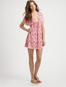 An irresistible pastel print and flattering silhouette, thanks to a classic Empire waist, make this the perfect coverup.Deep v-necklineDolman sleevesSelf-tie, drawstring waist92% polyester/8% spandexDry cleanImported of domestic fabric An irresistible pastel print and flattering silhouette, thanks to a classic Empire waist, make this the perfect coverup.Deep v-necklineDolman sleevesSelf-tie, drawstring waist92% polyester/8% spandexDry cleanImported of domestic fabric